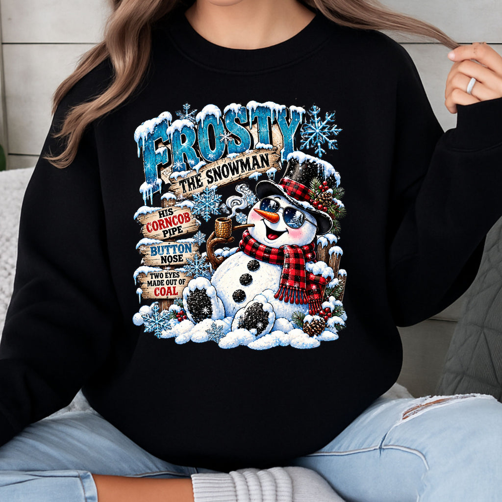 Frosty is bringing the cool factor! Rocking his stylish sunglasses, classic top hat, and cozy red plaid scarf, this snowman is ready to steal the show! Gildan Crewneck Pullover Sweatshirt